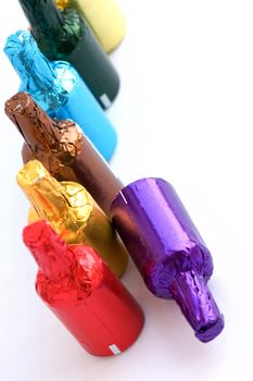 Close up view of colorful chocolate bottles 