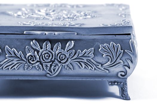 Old silver metallic jewelry casket over white background 