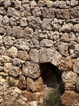 An old and neglected historic Roman wall and door on the island of Malta