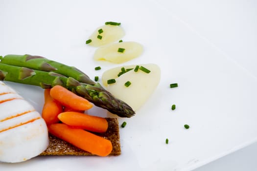 Diet meal, asparagus with carrots and sea food