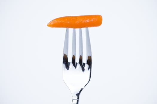 diet, carrot bite in a fork