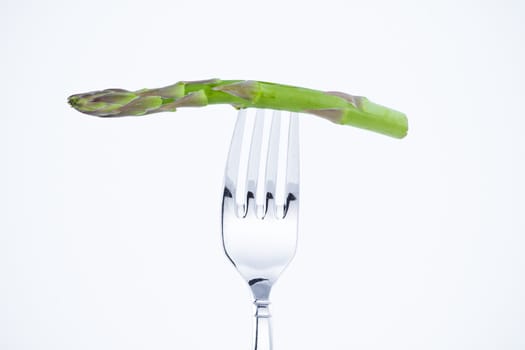 diet, asparagus bite in a fork