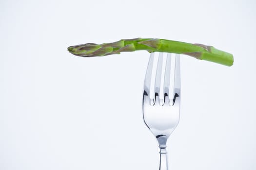 diet, asparagus bite in a fork