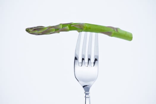 diet, asparagus bite in a fork