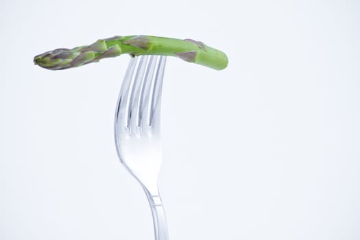 diet, asparagus bite in a fork