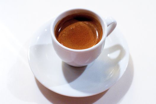 Cup of espresso coffee on the white background