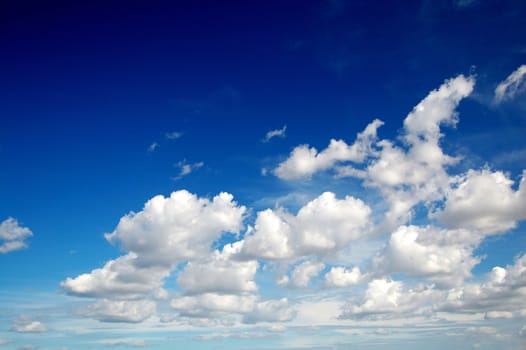 Blue sky with cotton like clouds