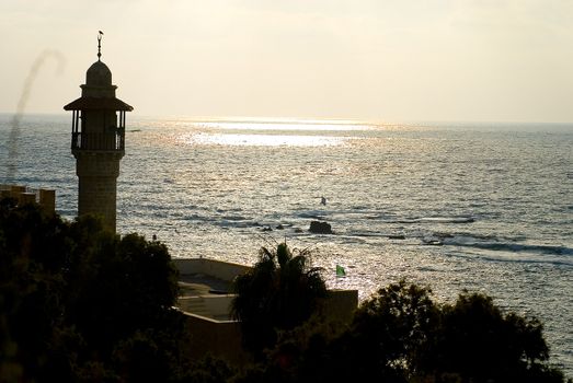 Minaret of mosque with the view on the sea