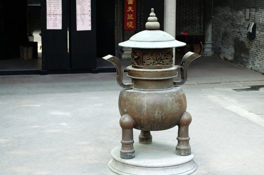 An old incense holder in a Chinese temple