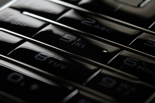 Close up shot of mobile keypad under dark environment