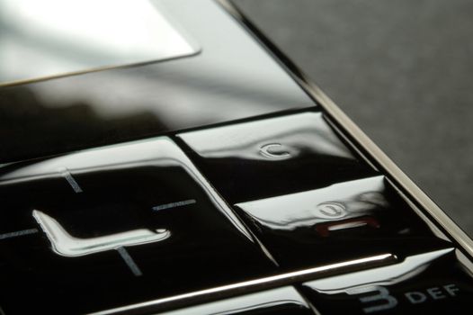 Close up shot of mobile keypad under dark environment