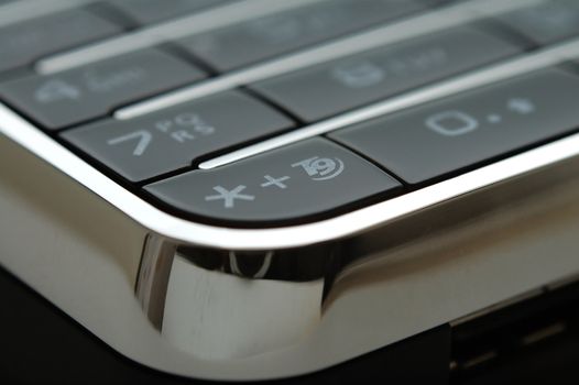 A close up shot of mobile keypad under light
