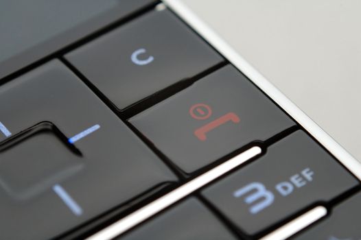 A close up shot of mobile keypad under light