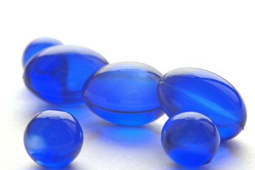 An abstract picture of vitamins pills in blue color