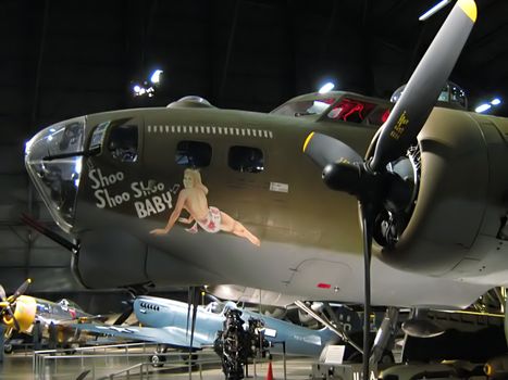 A photograph of nose art on a World War II era airplane.