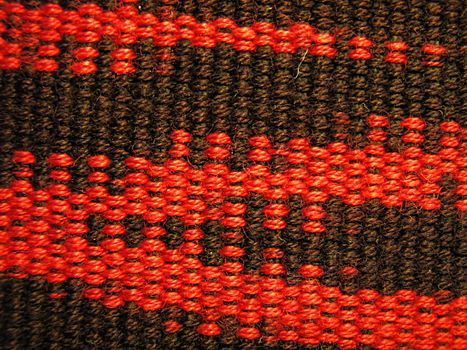 A photograph of red and black fabric.