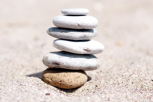 Zen beach stones on the sand