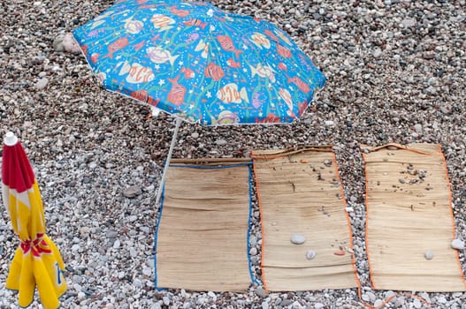 empty place for sunbath on pebble beach