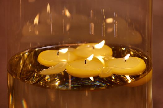 An extreme close shot of burning candles