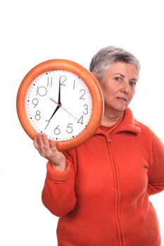 mature woman with clock over white background