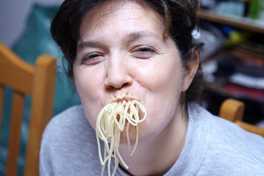 woman eating spaghetti, humor photograhy