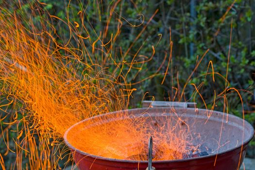 Sparks flying off a grill