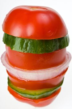 tomato and cucumber salad on a white plate