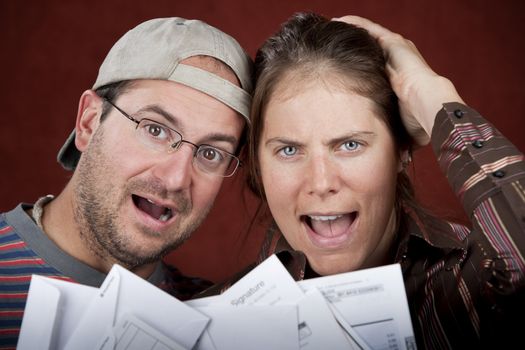 Young couple upset over too many bills