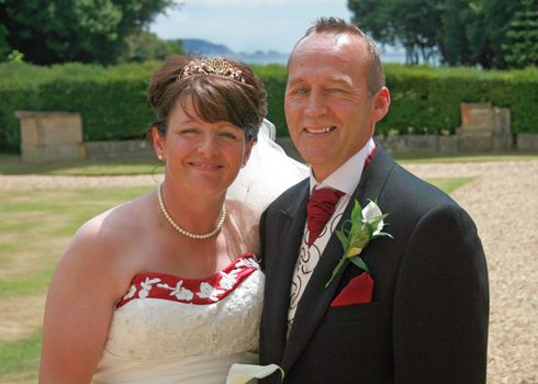 Bride and Groom smiling after the wedding.