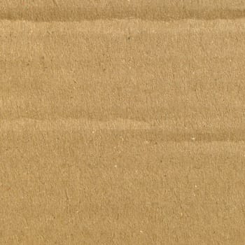 Brown grunge corrugated cardboard sheet useful as a background