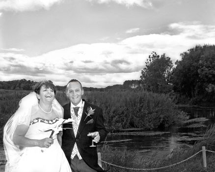 Bride and Groom smiling and laughing after their wedding