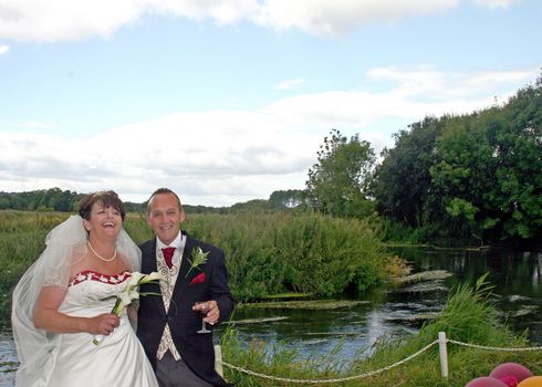 Bride and Groom smiling and laughing after their wedding