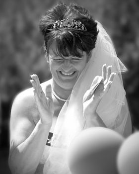 The Bride laughing at the reception after the wedding