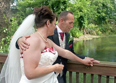 A Bride and Groom looking at their rings after the wedding.