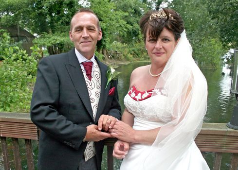 A Bride and Groom smiling at their reception after the wedding.