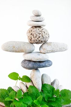 Construction of gravel as a pyramid in front of green leaves