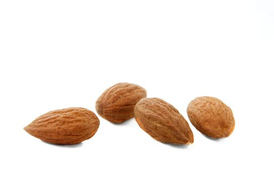 Separated pieces of almond isolated on white background