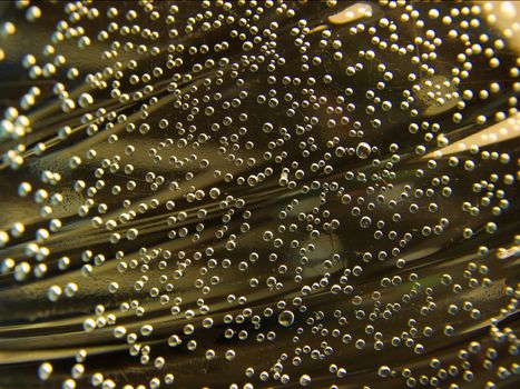 closeup of many small bubbles with golden background