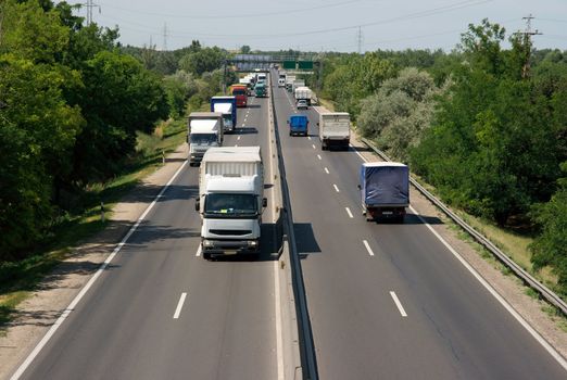 Highway with trucks passing by