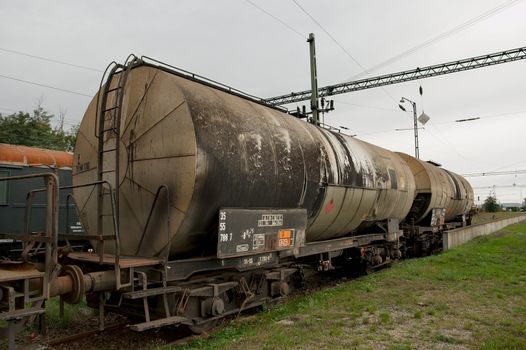 Old, abandoned, rusty oil transporting railway wagons