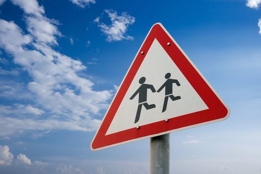 Pedestrians crossing the road warning sign