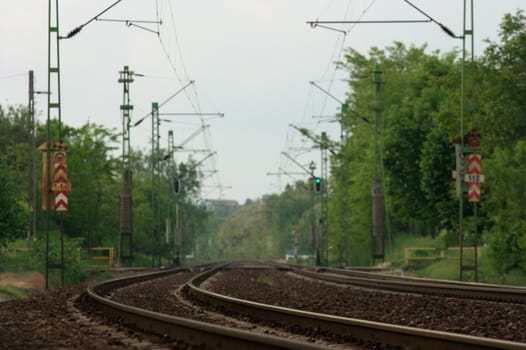 A pair of railway tracks in a bend