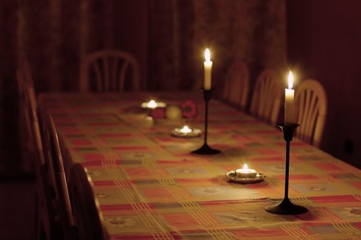 Dining table in dim light with candles