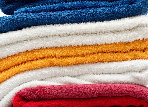 A pile of towels with different colors