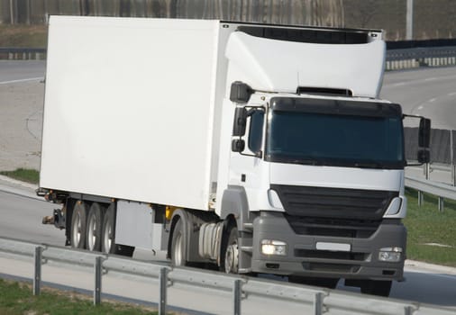 Big white truck on the highway