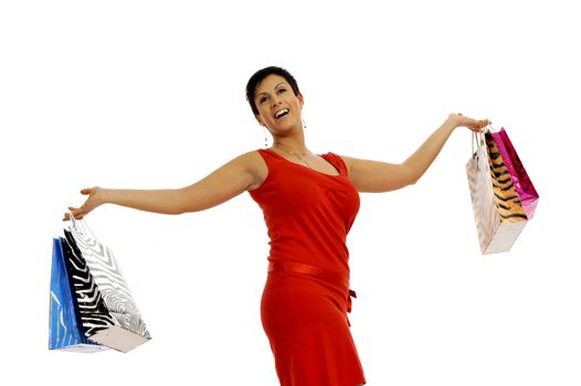 Half body view of young attractive woman doing shopping with lots of shopping bags. Isolated on white background.