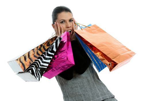 Half body view of young attractive woman doing shopping with lots of shopping bags. Isolated on white background.