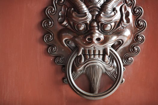 antique oriental door knocker