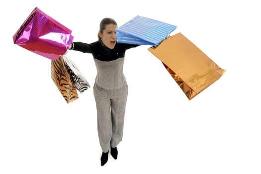 Full body view of young attractive woman in business wear,  going shopping with lots of colorful shopping bags. Isolated on white background.