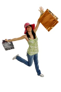 Full body view of young attractive woman going shopping with lots of colorful shopping bags. Isolated on white background.